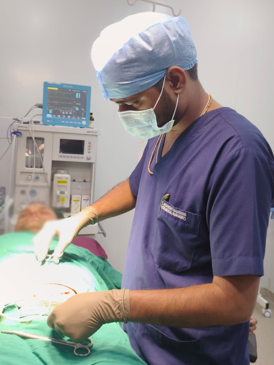 Dr. Ashish Kaushik operating in the theatre