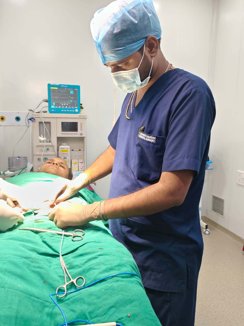 Dr. Ashish Kaushik operating in the theatre